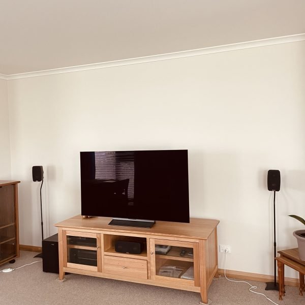 Flat-screen TV mounted on drywall in residential home