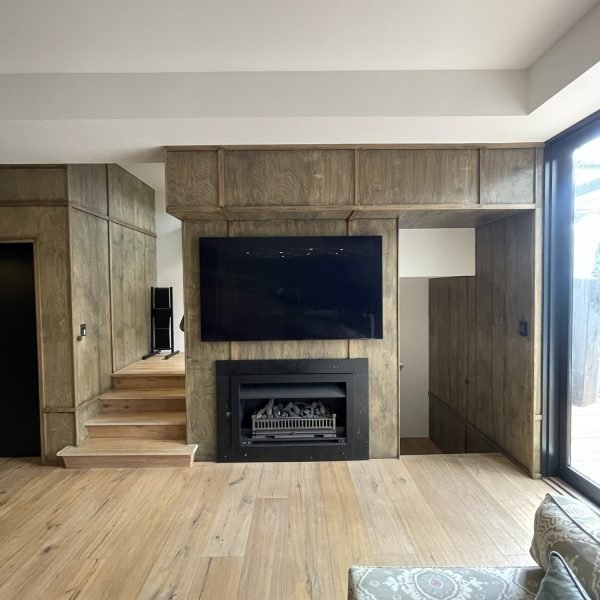 Flat-screen TV mounted on drywall in residential home