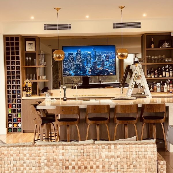 Flat-screen TV mounted on drywall in residential home