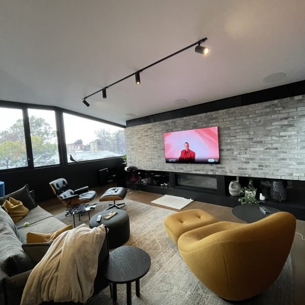 Flat-screen TV mounted on drywall in residential home