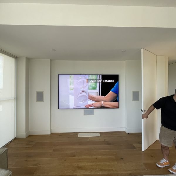 Flat-screen TV wall mounted on drywall in residential home